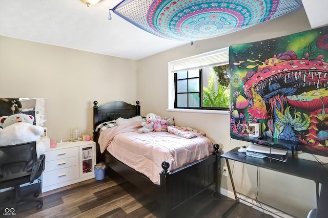 bedroom with dark wood-type flooring