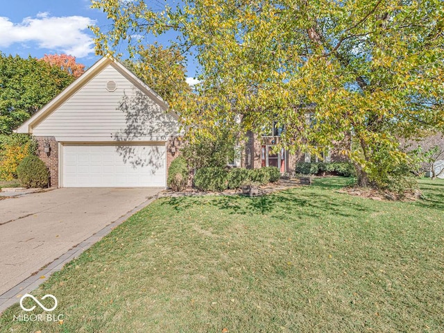 view of property hidden behind natural elements featuring a front lawn, an attached garage, concrete driveway, and brick siding