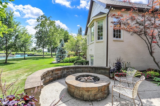 view of patio / terrace featuring an outdoor fire pit