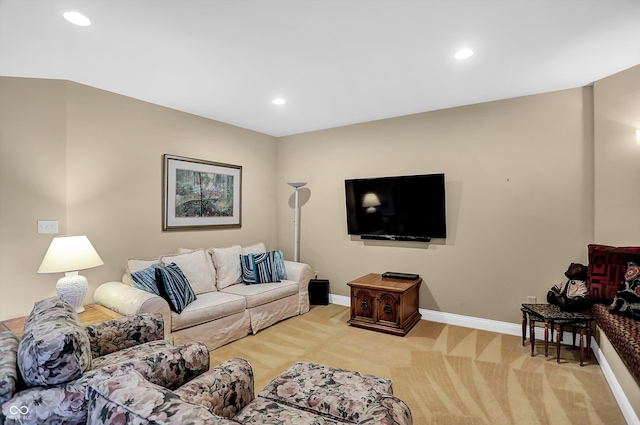 carpeted living area with baseboards and recessed lighting