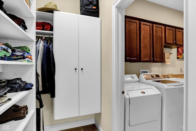 laundry room featuring independent washer and dryer, a sink, and cabinet space