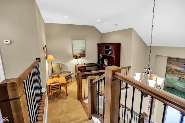 hall featuring lofted ceiling, recessed lighting, light carpet, an upstairs landing, and an inviting chandelier