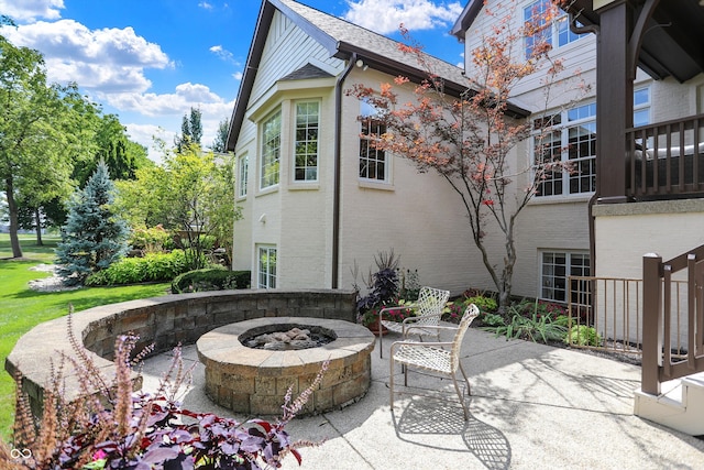 view of patio / terrace with a fire pit