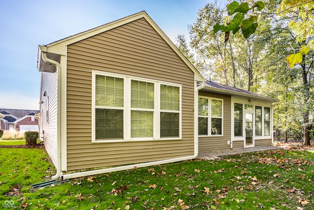 back of house with a yard