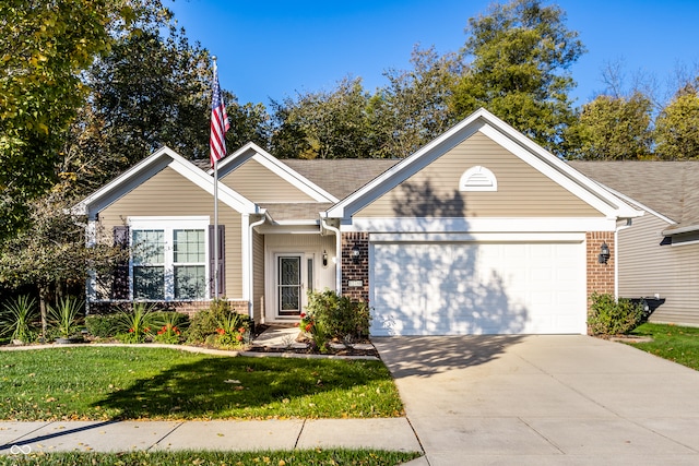 view of front of house with a front lawn and a garage