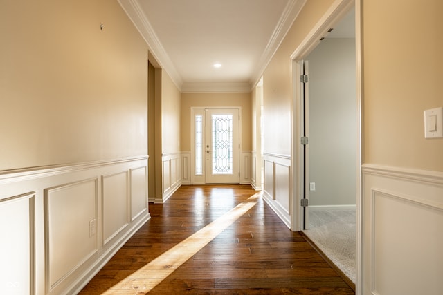 entryway featuring dark wood-type flooring and crown molding