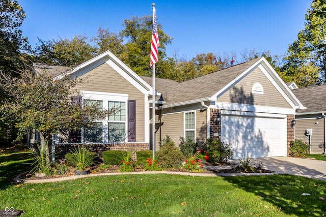 view of front of property with a front yard and a garage