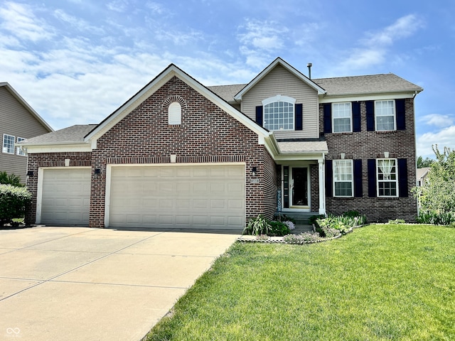 view of front of home featuring a front yard and a garage