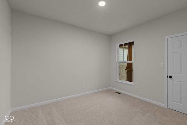 view of carpeted spare room