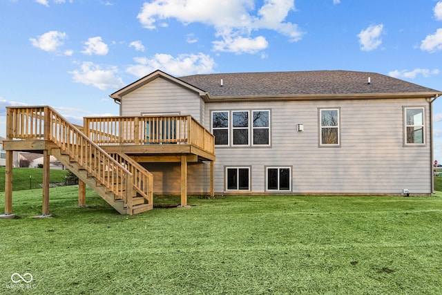 rear view of property with a lawn and a deck