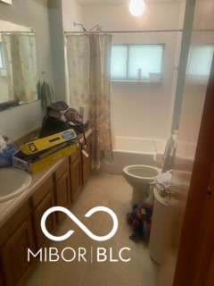 full bathroom with vanity, shower / bath combination with curtain, and toilet