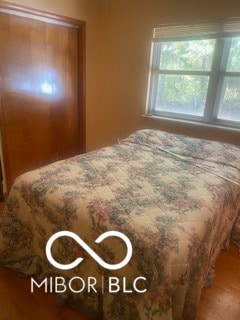 bedroom with wood-type flooring