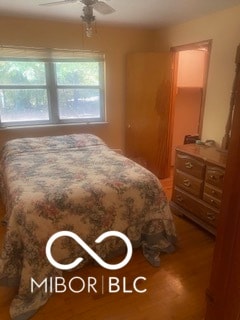 bedroom featuring ceiling fan and wood-type flooring