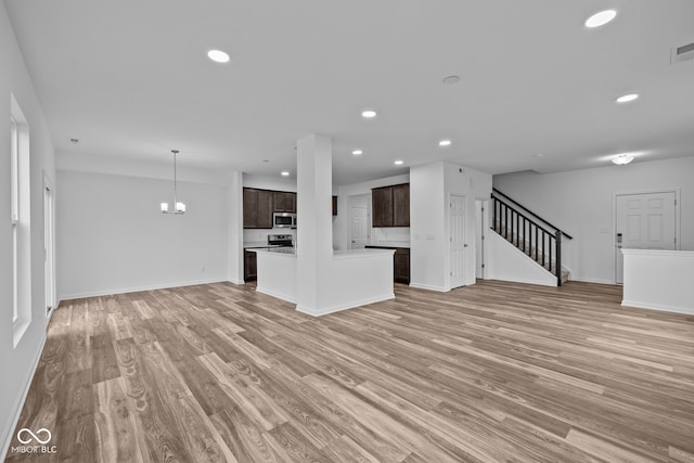 unfurnished living room featuring light hardwood / wood-style floors