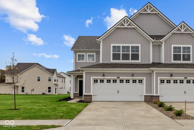 view of front of property featuring a front yard and a garage