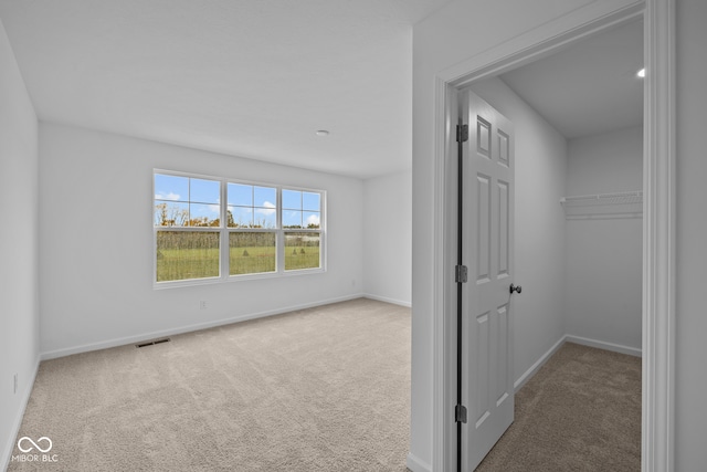 corridor with carpet flooring