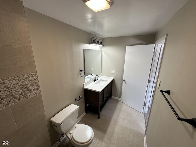 bathroom with toilet and vanity