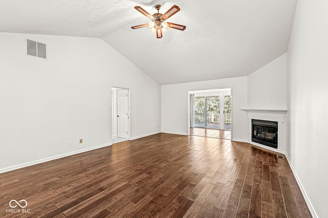 unfurnished living room with ceiling fan, lofted ceiling, and dark hardwood / wood-style flooring