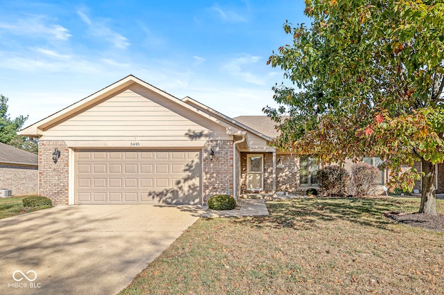 view of front of property with a garage and a front yard