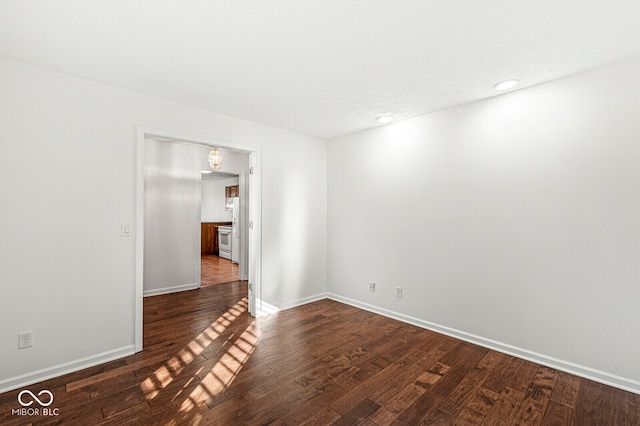 empty room featuring dark hardwood / wood-style flooring