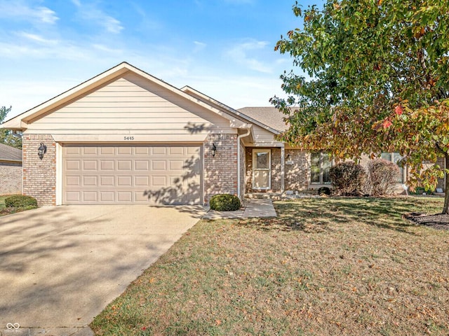 view of front of home with a garage and a front lawn