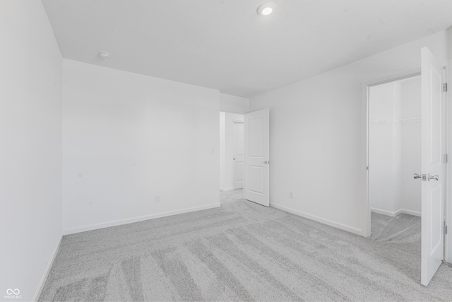 unfurnished room with light colored carpet