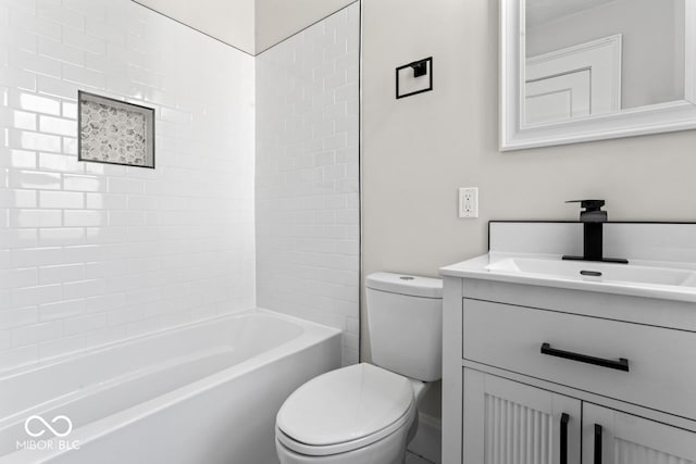 bathroom with toilet, bathtub / shower combination, and vanity