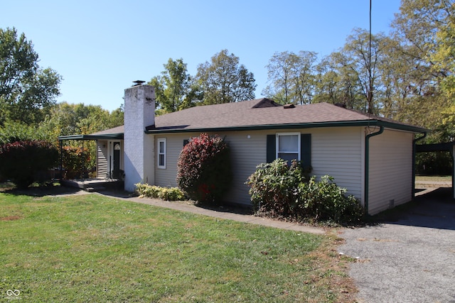 back of house with a yard