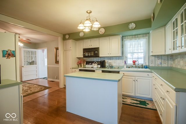 kitchen with a center island, hanging light fixtures, white cabinetry, dark wood-type flooring, and white electric range