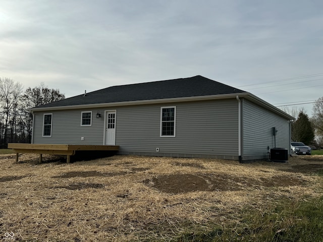 back of house featuring a wooden deck