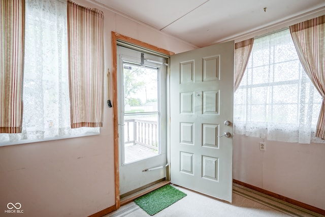 doorway featuring carpet floors