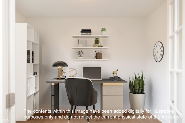 office area with baseboards and built in desk