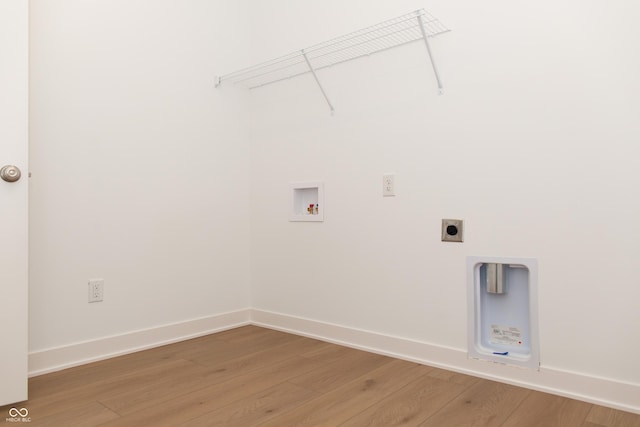 laundry room featuring hookup for an electric dryer, laundry area, baseboards, hookup for a washing machine, and light wood-style flooring