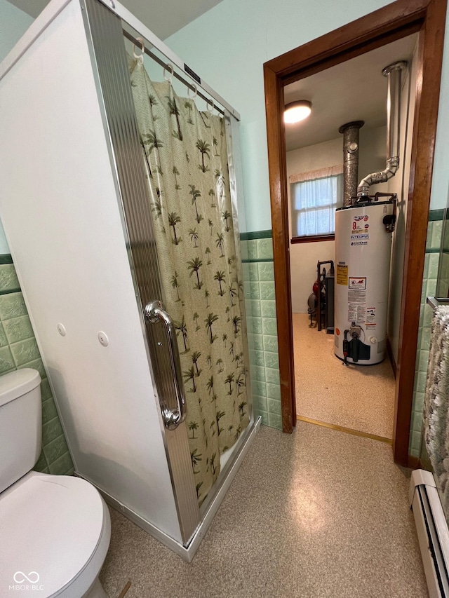 bathroom with a shower stall, tile walls, gas water heater, and baseboard heating
