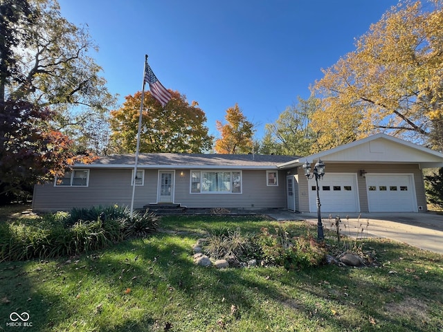 single story home with an attached garage, driveway, and a front yard