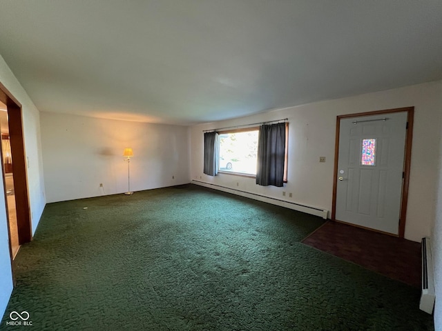 interior space featuring dark colored carpet and a baseboard radiator