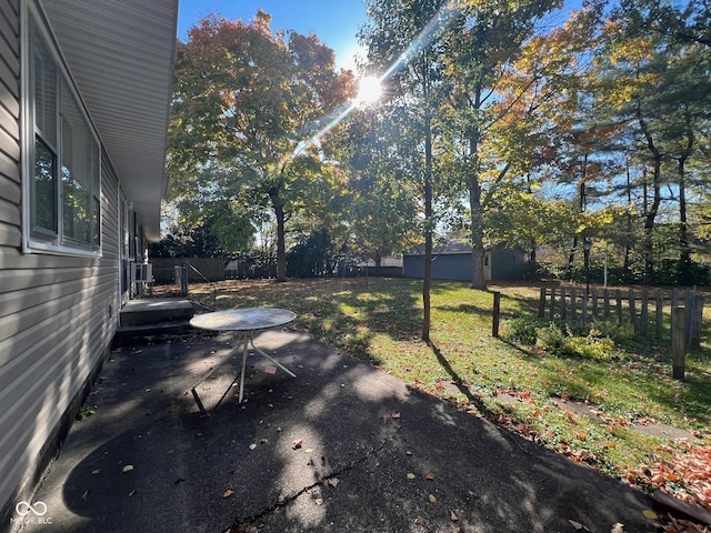 view of yard with a fenced backyard and a patio