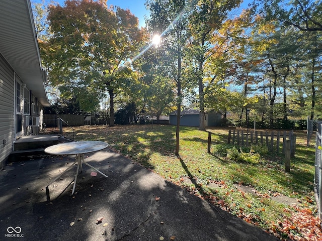 view of yard with a patio and a fenced backyard