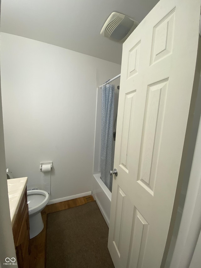 full bathroom featuring toilet, visible vents, baseboards, wood finished floors, and vanity