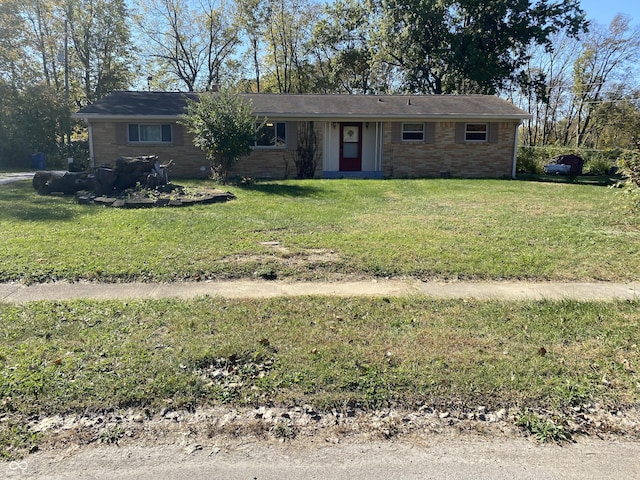 ranch-style house with brick siding and a front yard