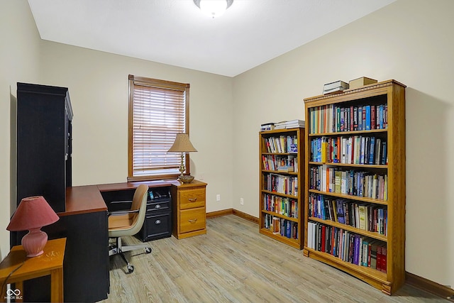 office with light hardwood / wood-style flooring