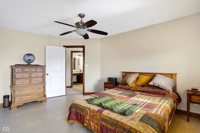 bedroom with ceiling fan and light hardwood / wood-style floors