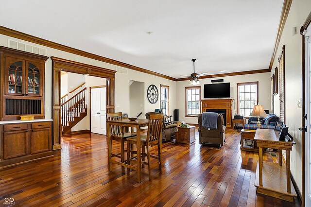 7178 Lockford N, Avon, IN 46123 - living room featuring a fireplace, dark wood finished floors, a ceiling fan, visible vents, and stairway