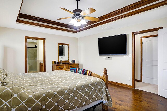 7178 Lockford N, Avon, IN 46123 - bedroom featuring baseboards, dark wood-style flooring, crown molding, and a tray ceiling