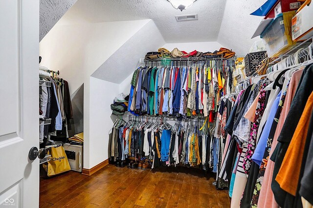 7178 Lockford N, Avon, IN 46123 - walk in closet with visible vents, vaulted ceiling, and hardwood / wood-style floors