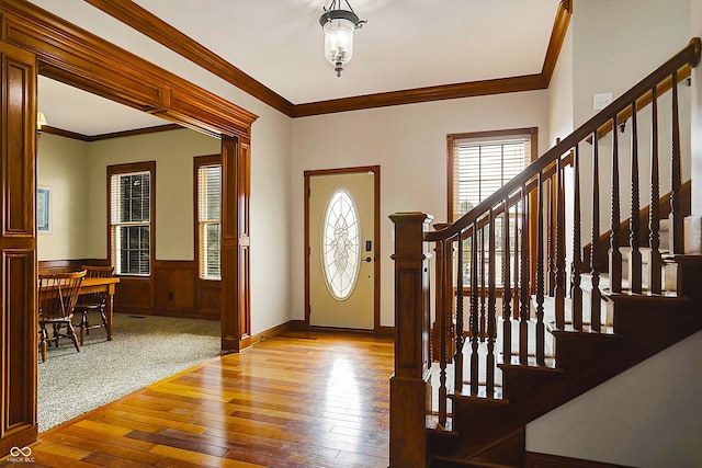 7178 Lockford N, Avon, IN 46123 - foyer entrance featuring crown molding, stairway, hardwood / wood-style flooring, and a wainscoted wall