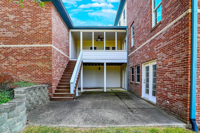 exterior space with ceiling fan and french doors