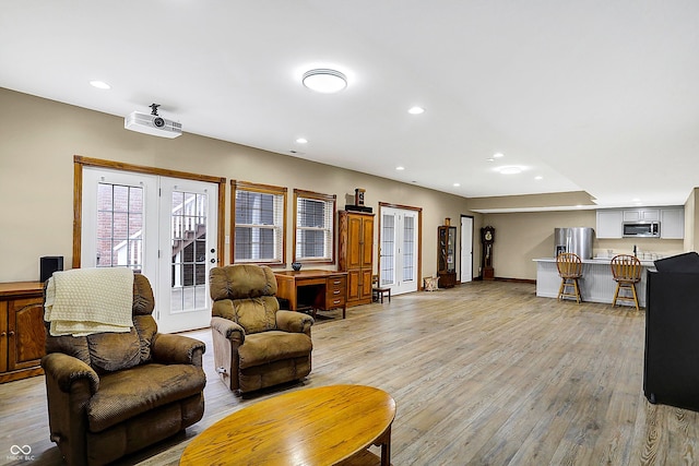 living room with light hardwood / wood-style flooring