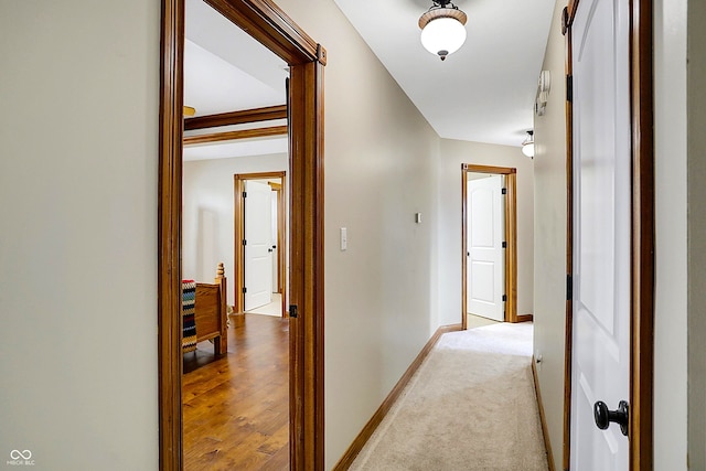 hallway with light carpet