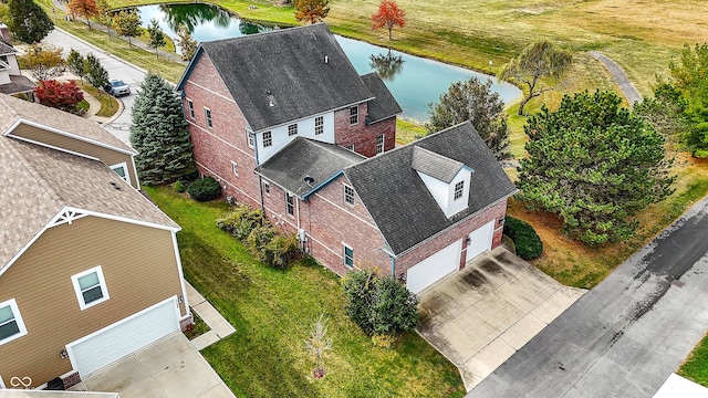 birds eye view of property featuring a water view